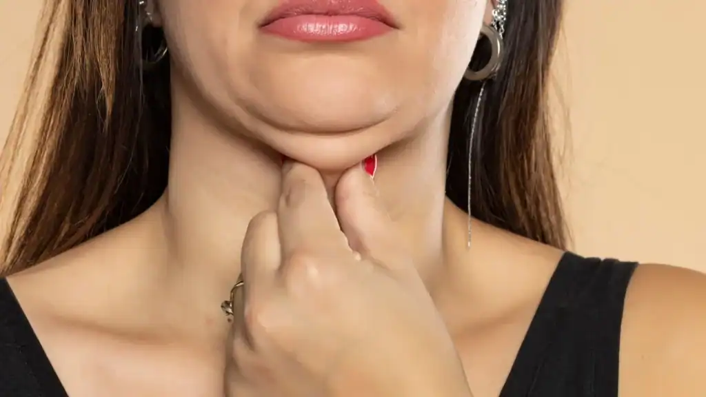 An image of a woman with double chin, sad, worried : Non Surgical Double Chin Removal Treatment in Broomhill, UK