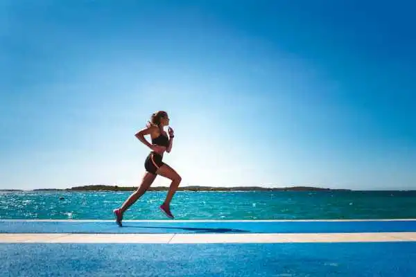 Woman running showing strong leg muscle Broomhill